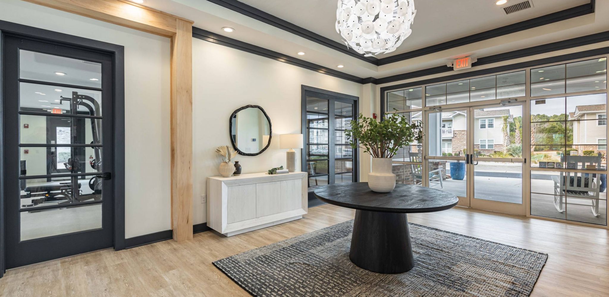 Hawthorne at Stillwater clubhouse lobby with door to fitness center.