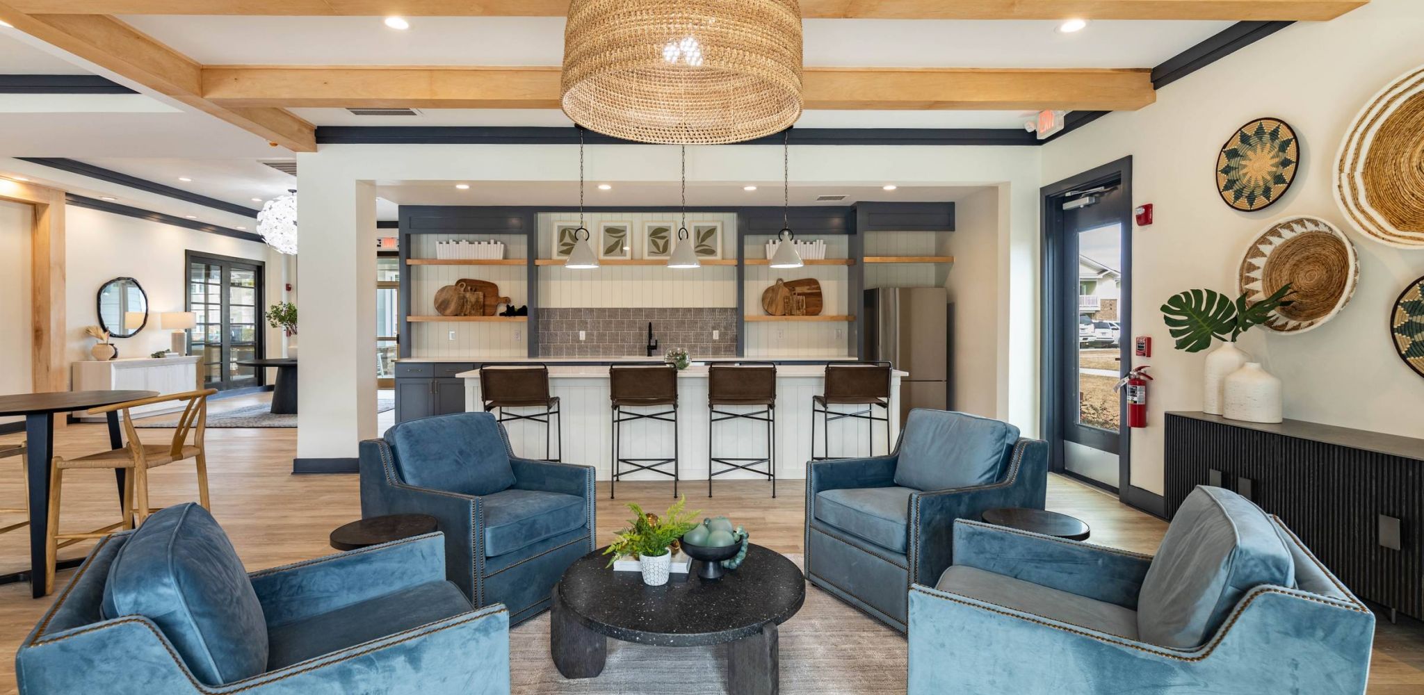 Inviting swimming pool with blue umbrellas and comfortable loungers at Hawthorne at Stillwater, a perfect spot for relaxation and socializing in Sneads Ferry.
